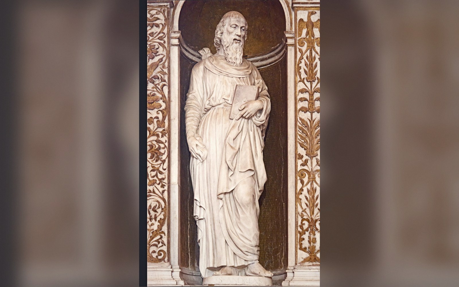 An altarpiece in its chapel, seen from the nave